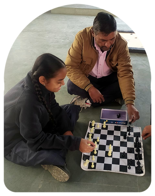 Students playing chess with their sports teacher