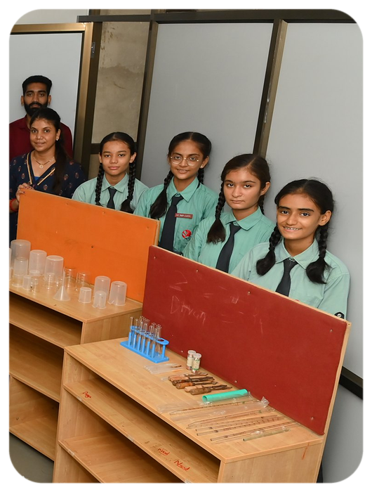 Senior students with their teacher in the chemistry laboratory