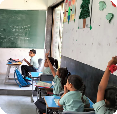 A primary class answering questions during a lesson