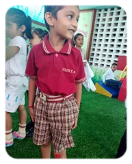 A pre-primary child in the Surya T-shirt