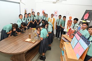 Students at the microscopes in the biology laboratory