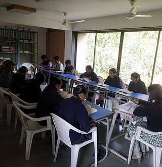 Students reading in the school library