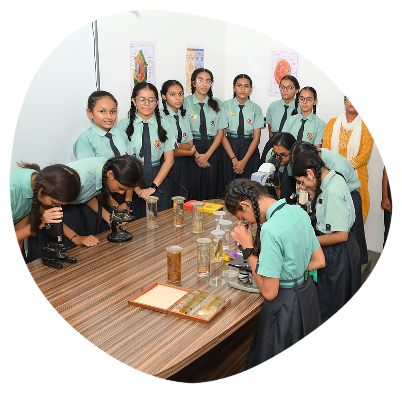 Students at the microscopes in the biology laboratory