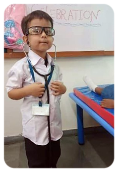 A pre-primary child dressed as a doctor on role-play day