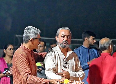 Trustees and guests performing aarti at the Navratri celebration