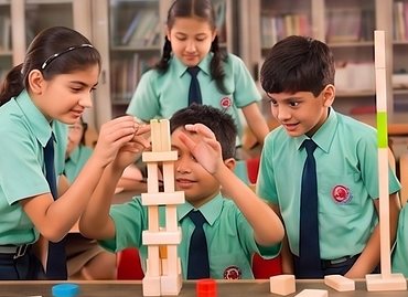 Students building a wooden block tower