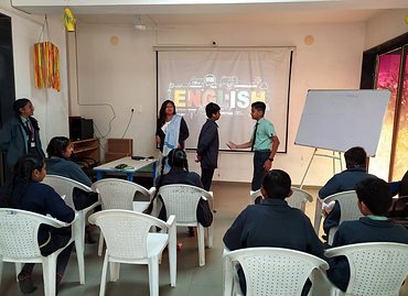 Students presenting in the English language lab