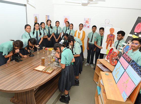 Students at the microscopes in the biology laboratory