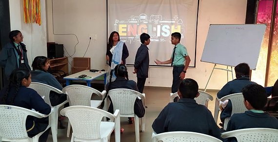 Students presenting in the English language lab