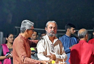 Trustees and guests performing aarti at the Navratri celebration
