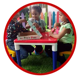 Pre-primary children at a pizza-shop role-play