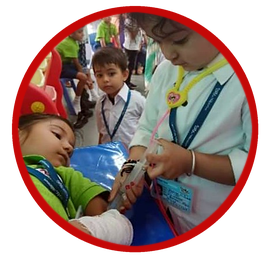 A pre-primary child playing doctor with a first-aid kit