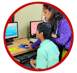 A teacher guiding a student in the computer lab